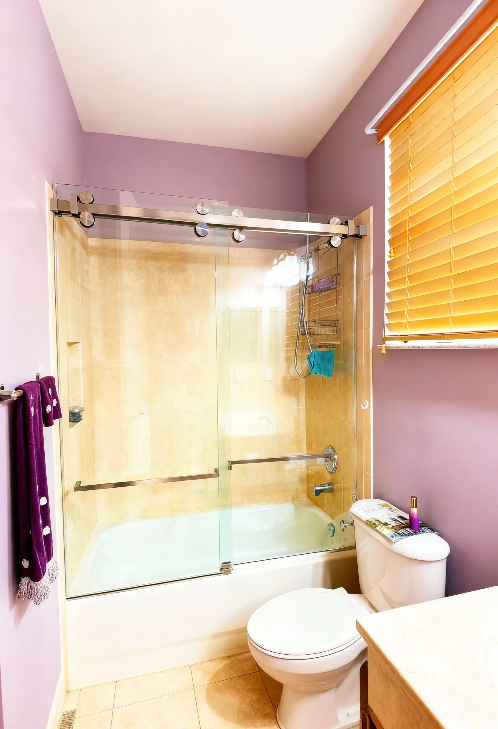High-quality glass shower door with sleek metal hardware in a modern bathroom setting.