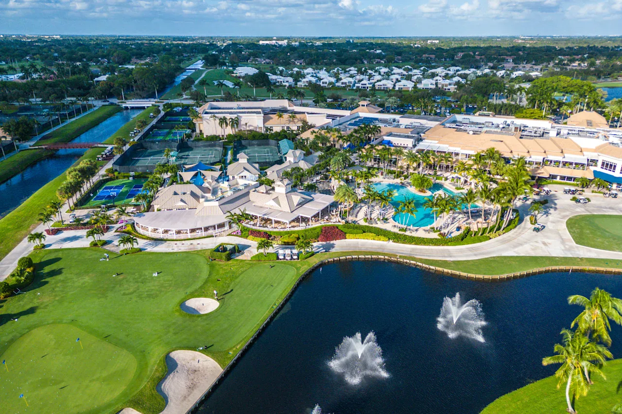 Stunning exterior glass railing overlooking the Polo Club golf course and water features.