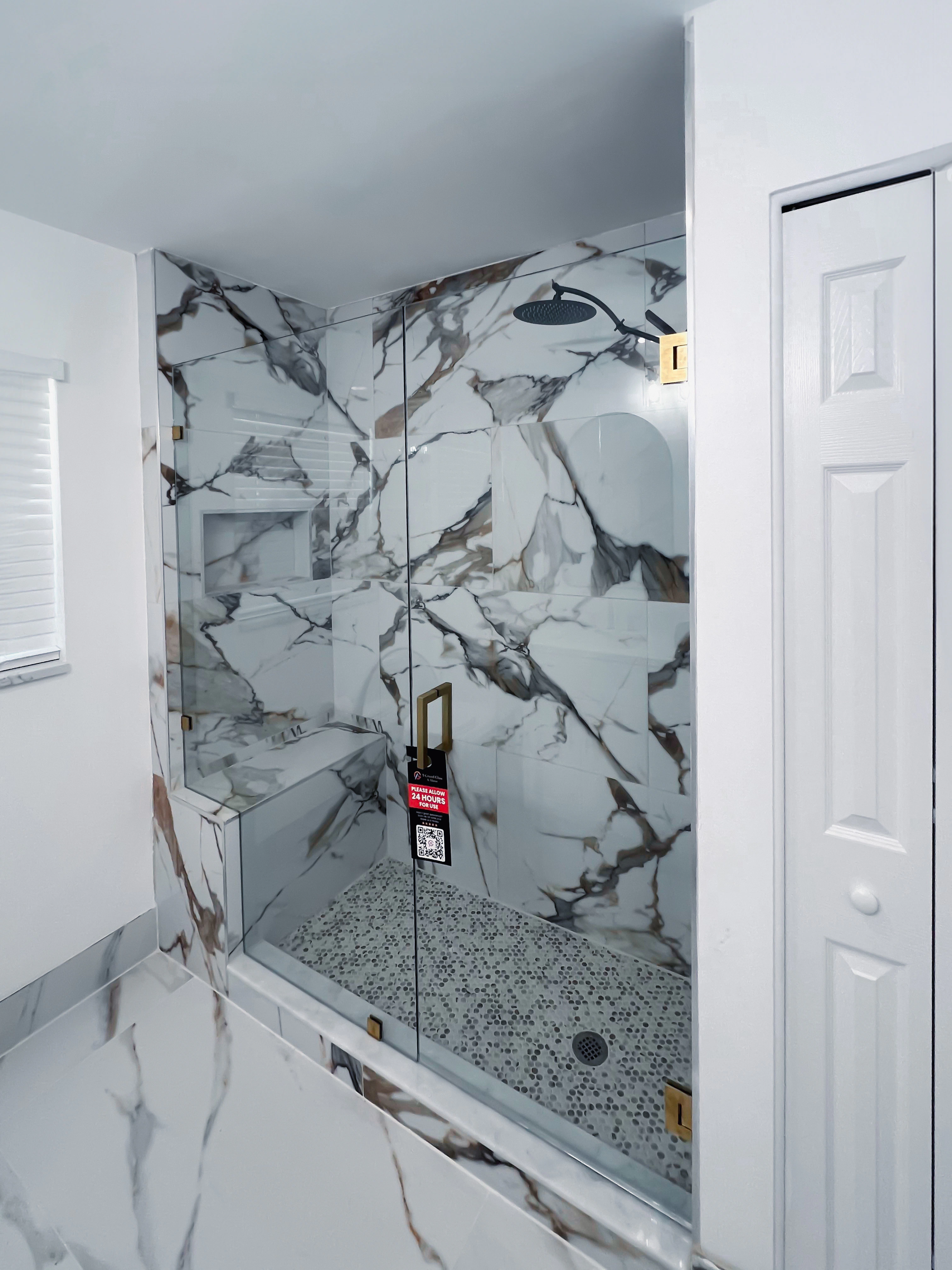High-end marble shower glass enclosure with durable frameless design.