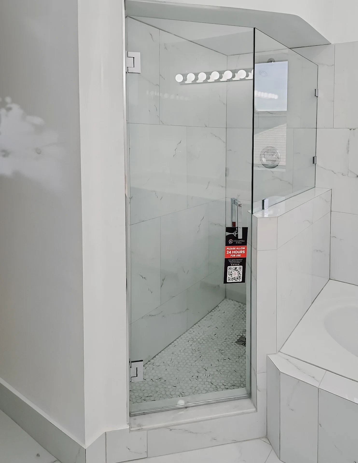 High-quality glass shower door with modern hardware, perfect for upscale bathrooms.