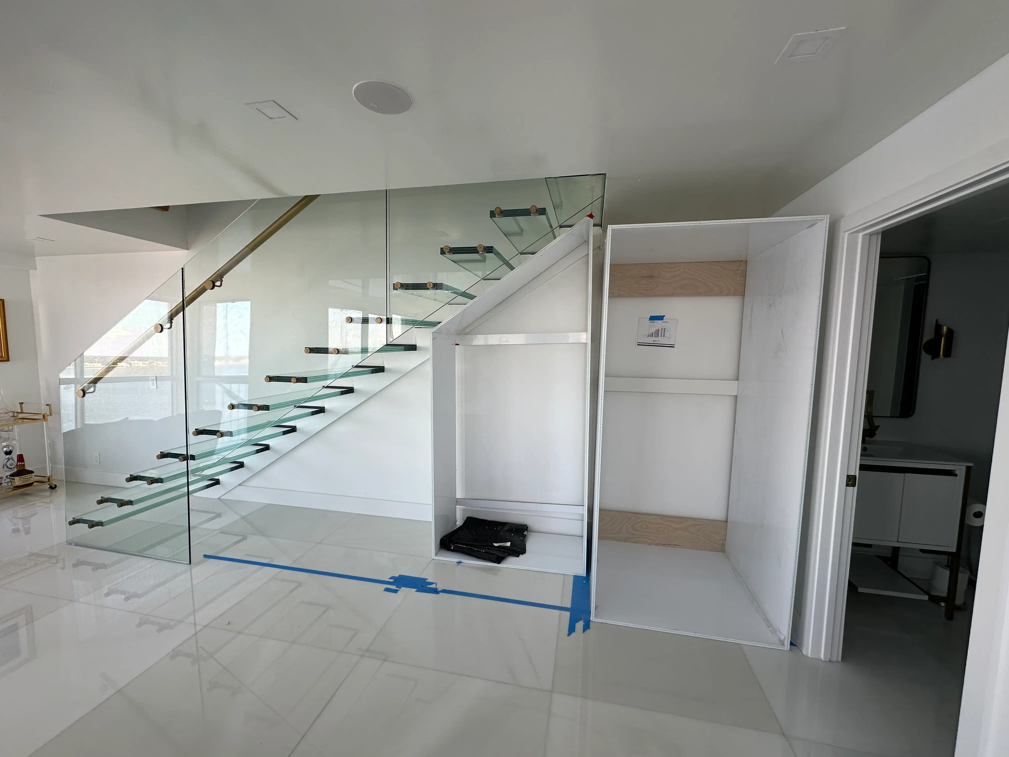 Modern glass staircase with sleek railing and elegant interior finish.