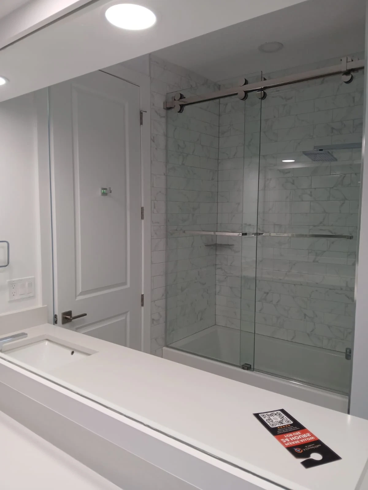 High-quality transparent glass shower enclosure in modern bathroom design.