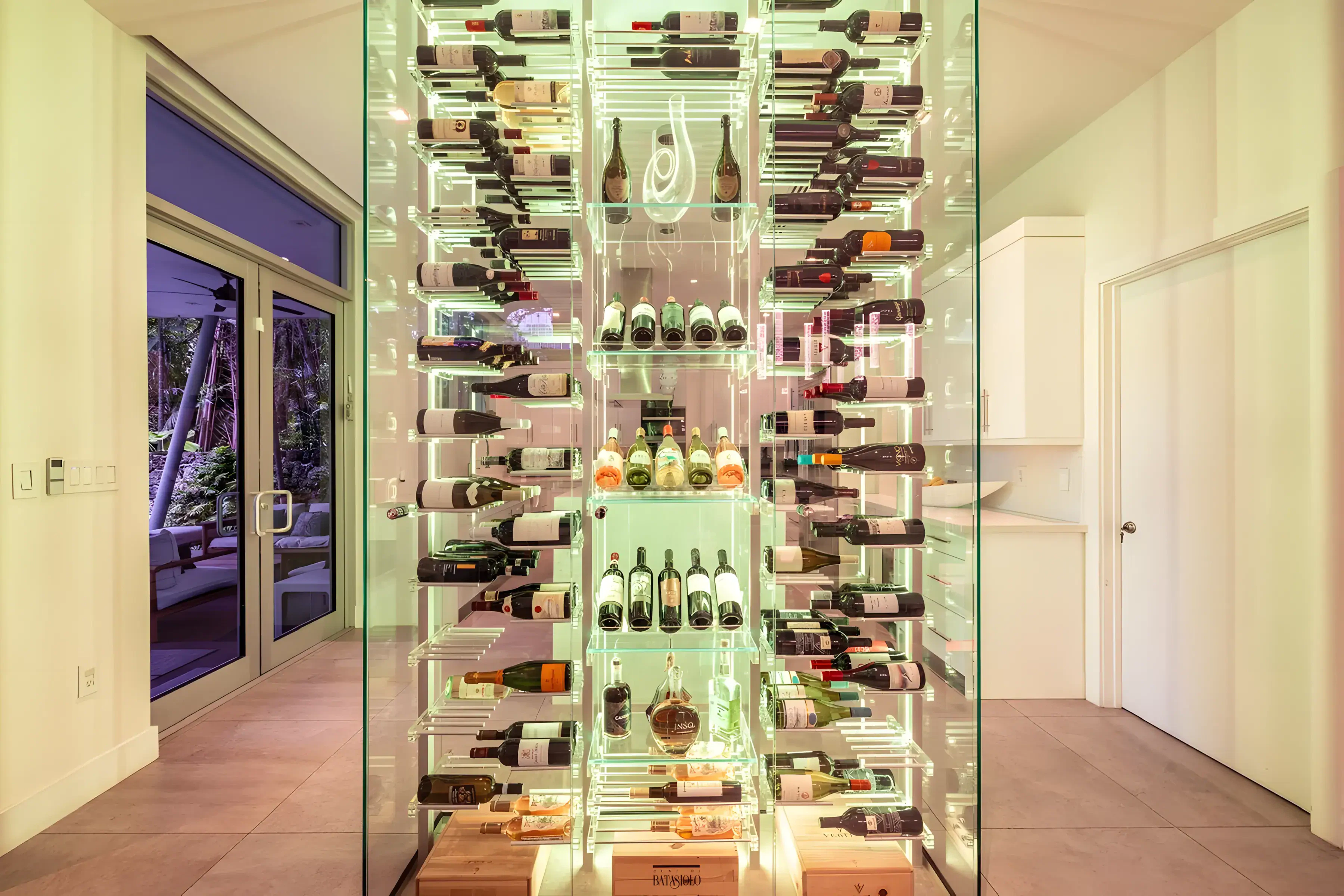 Highly detailed, luxurious wine storage with LED lighting and glass shelving for wine bottles.