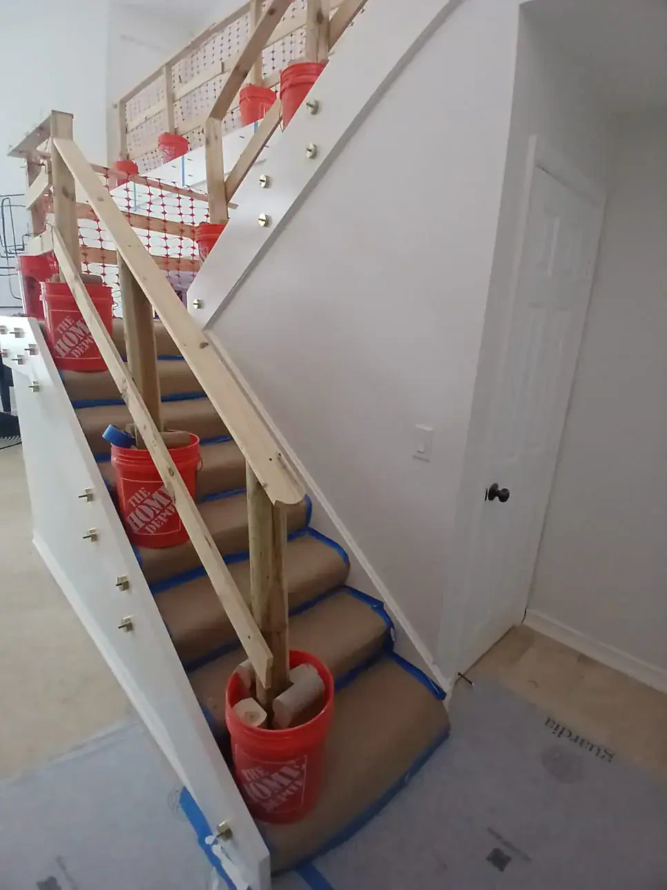 Custom glass and mirror installation for staircase renovation.