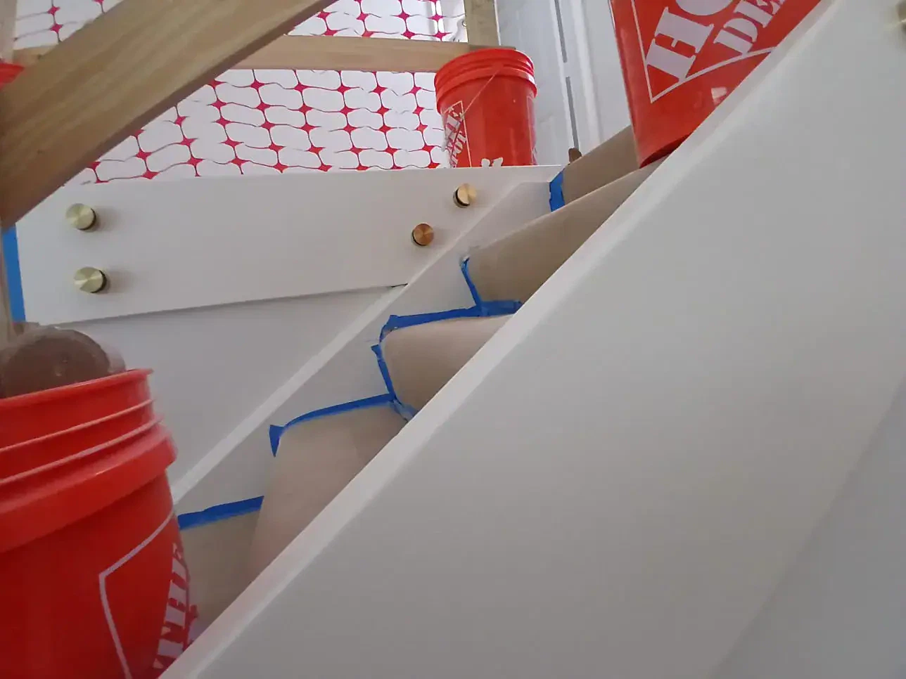 Close-up of glass mirrors and construction materials on site.