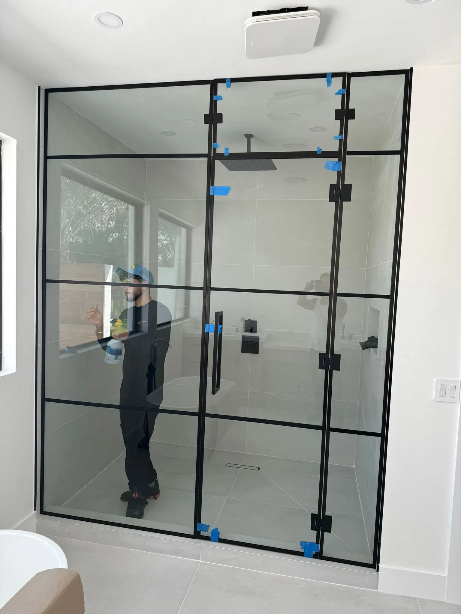 High-quality glass shower with black frame for modern bathrooms.