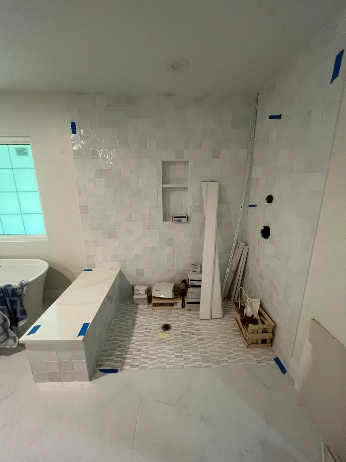 High-quality glass shower and custom mirror for modern bathroom design.
