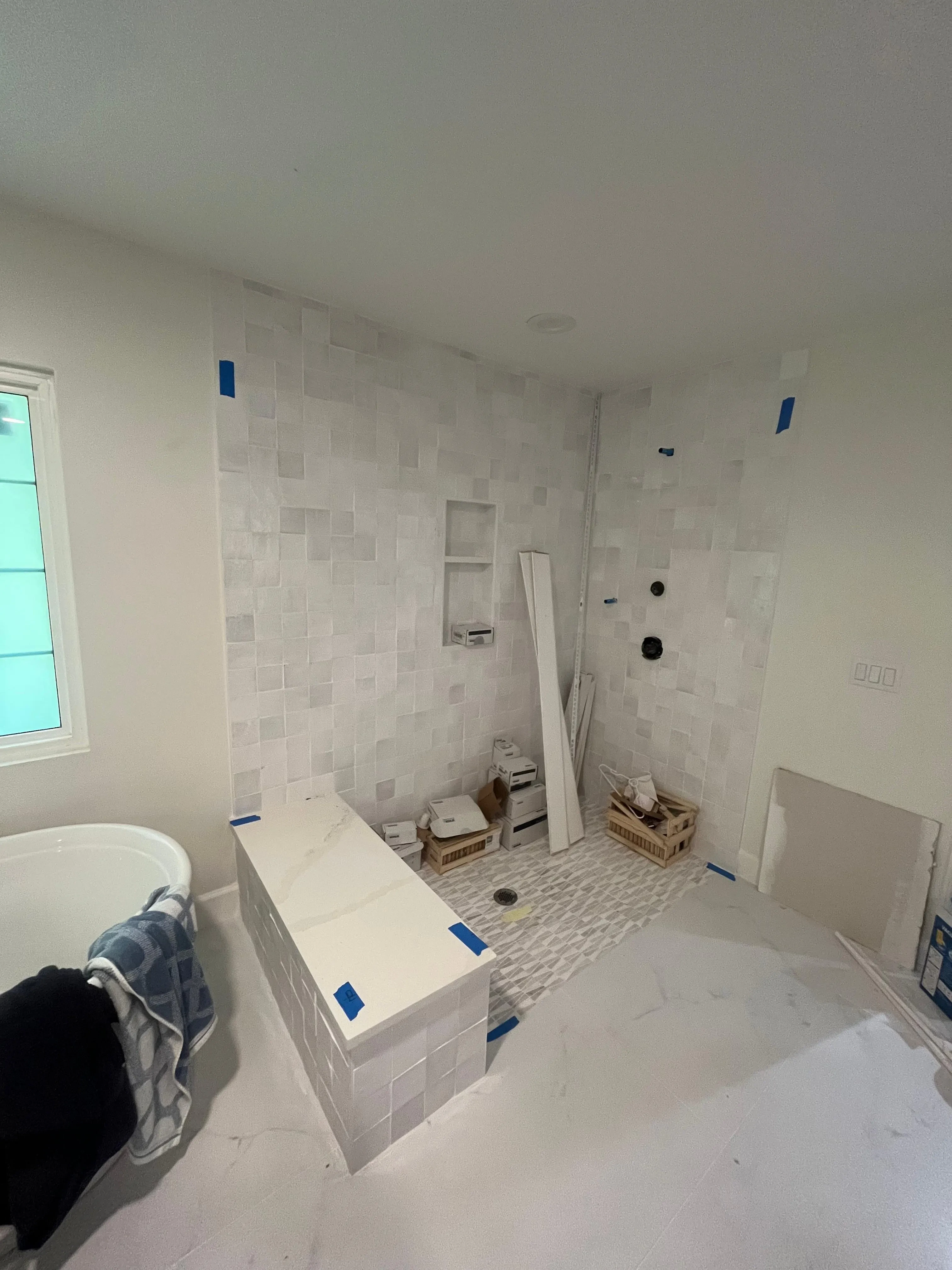 High-quality glass mirror installation in bathroom renovation.