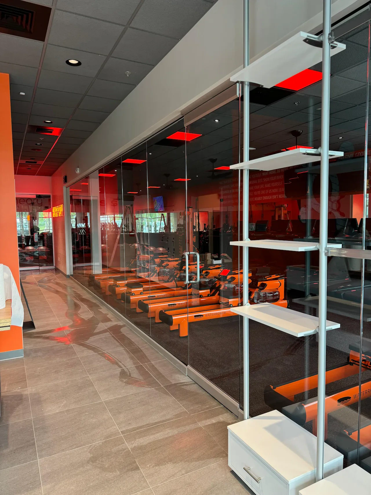 Clear large mirror in fitness center gym.