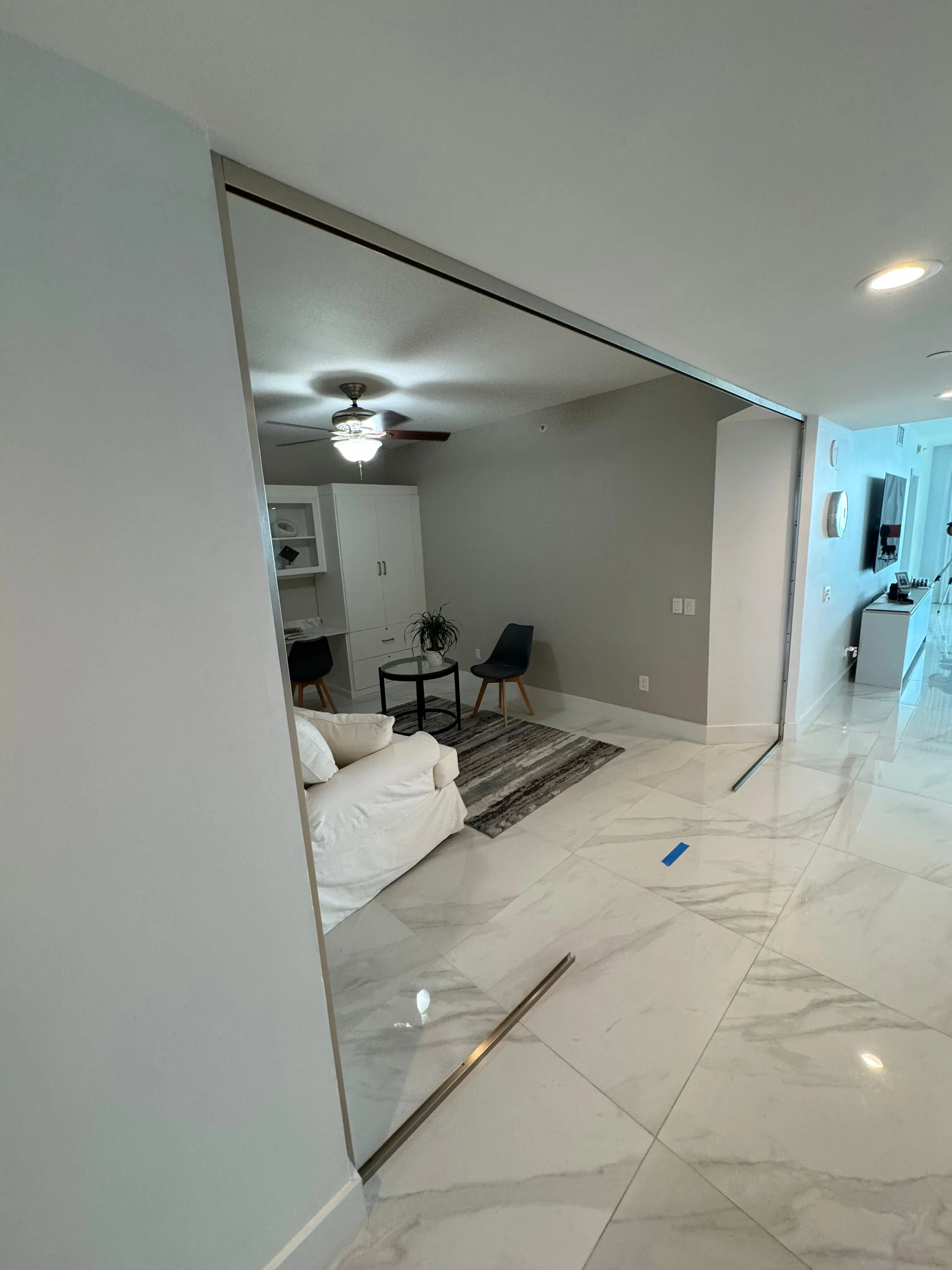 High-quality crystal glass mirror installation in modern living space.