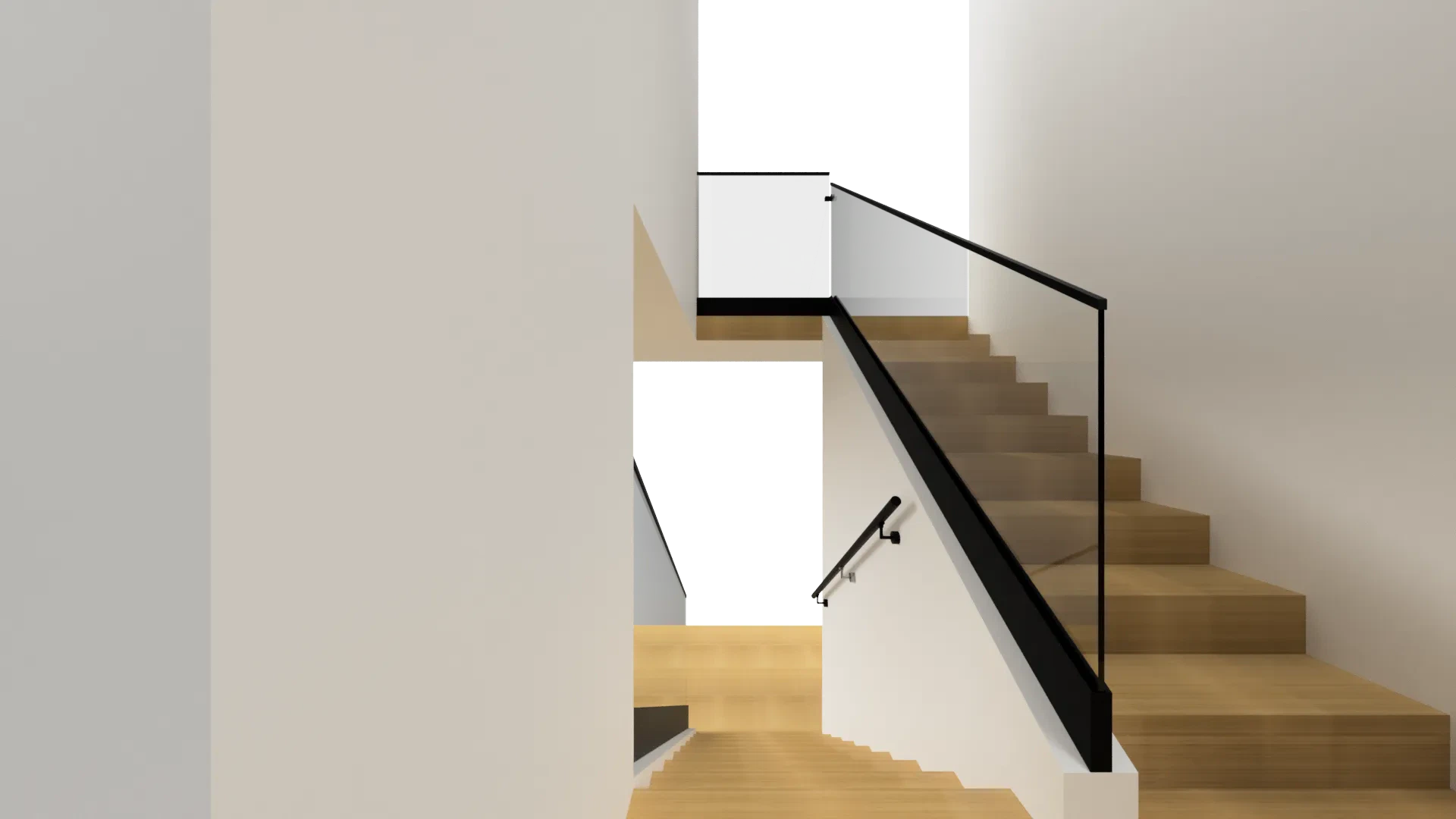 Clear glass and black metal staircase railing in contemporary home setting.