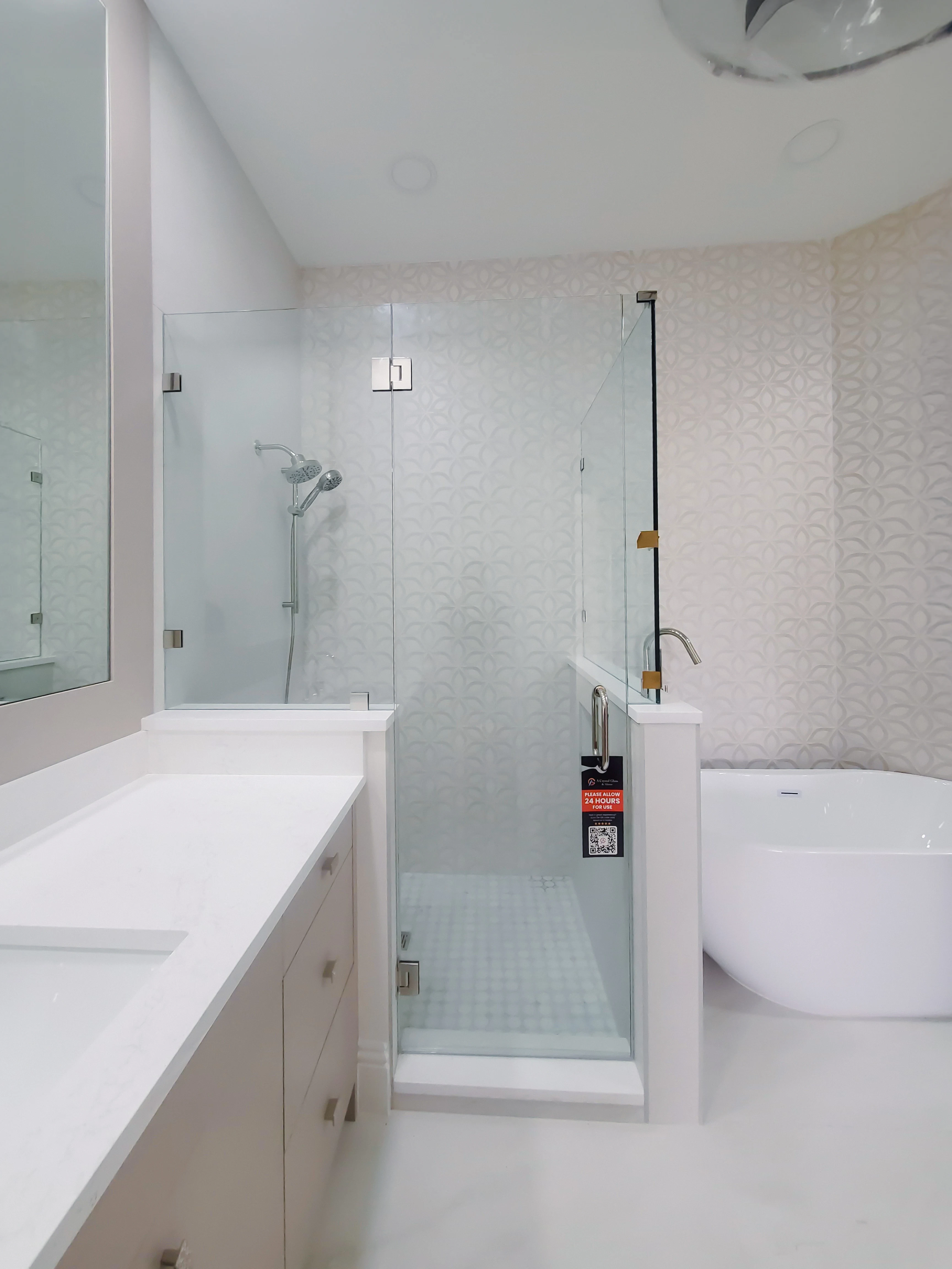 Custom glass shower enclosure for modern bathrooms.