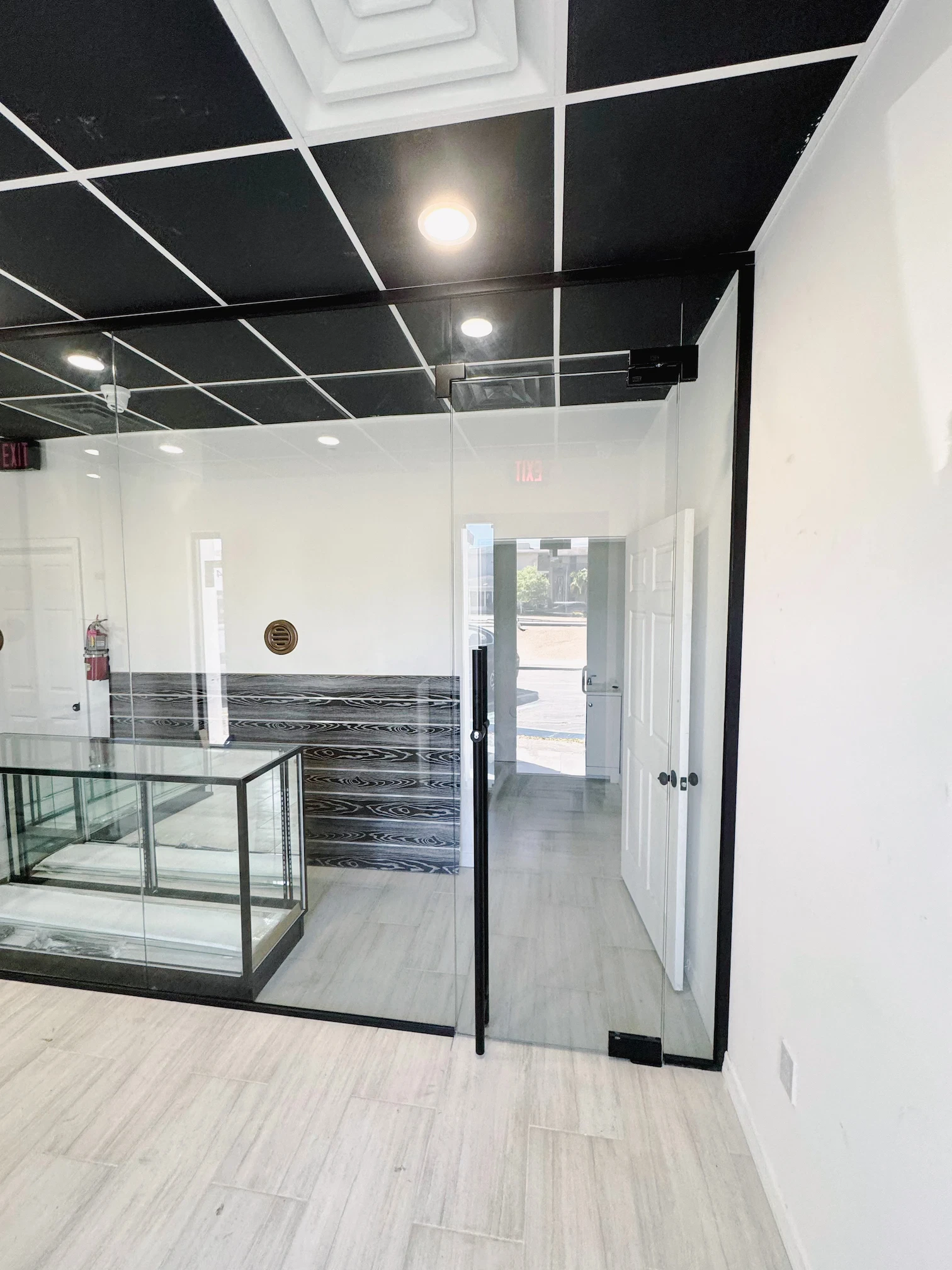 High-quality glass partition with sleek black framing in modern commercial space.