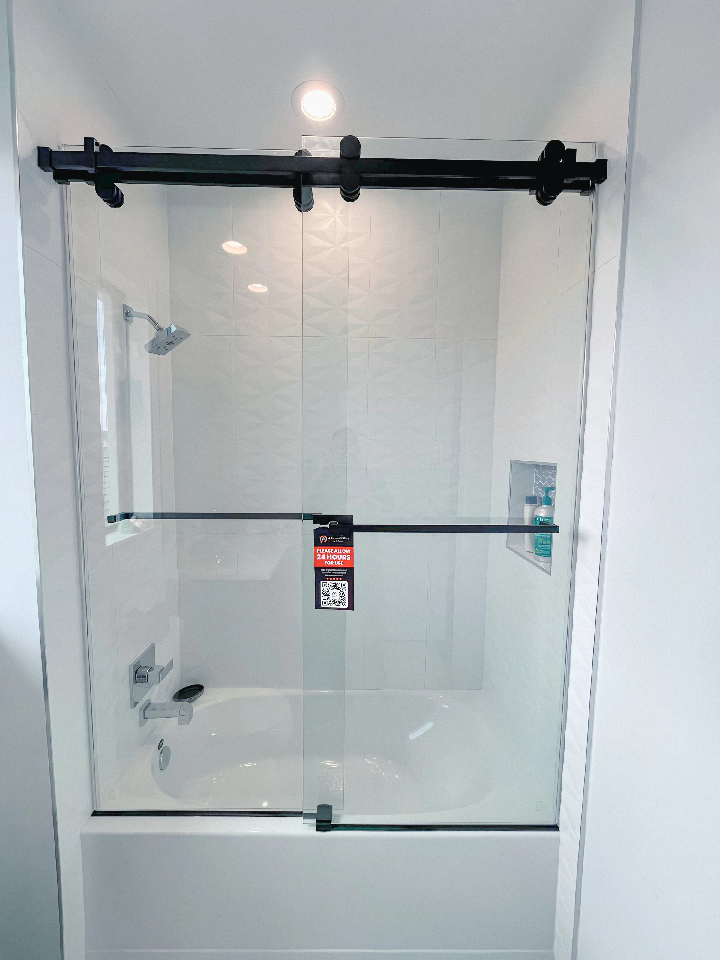 High-quality glass shower door with modern black hardware for stylish bathroom upgrade.