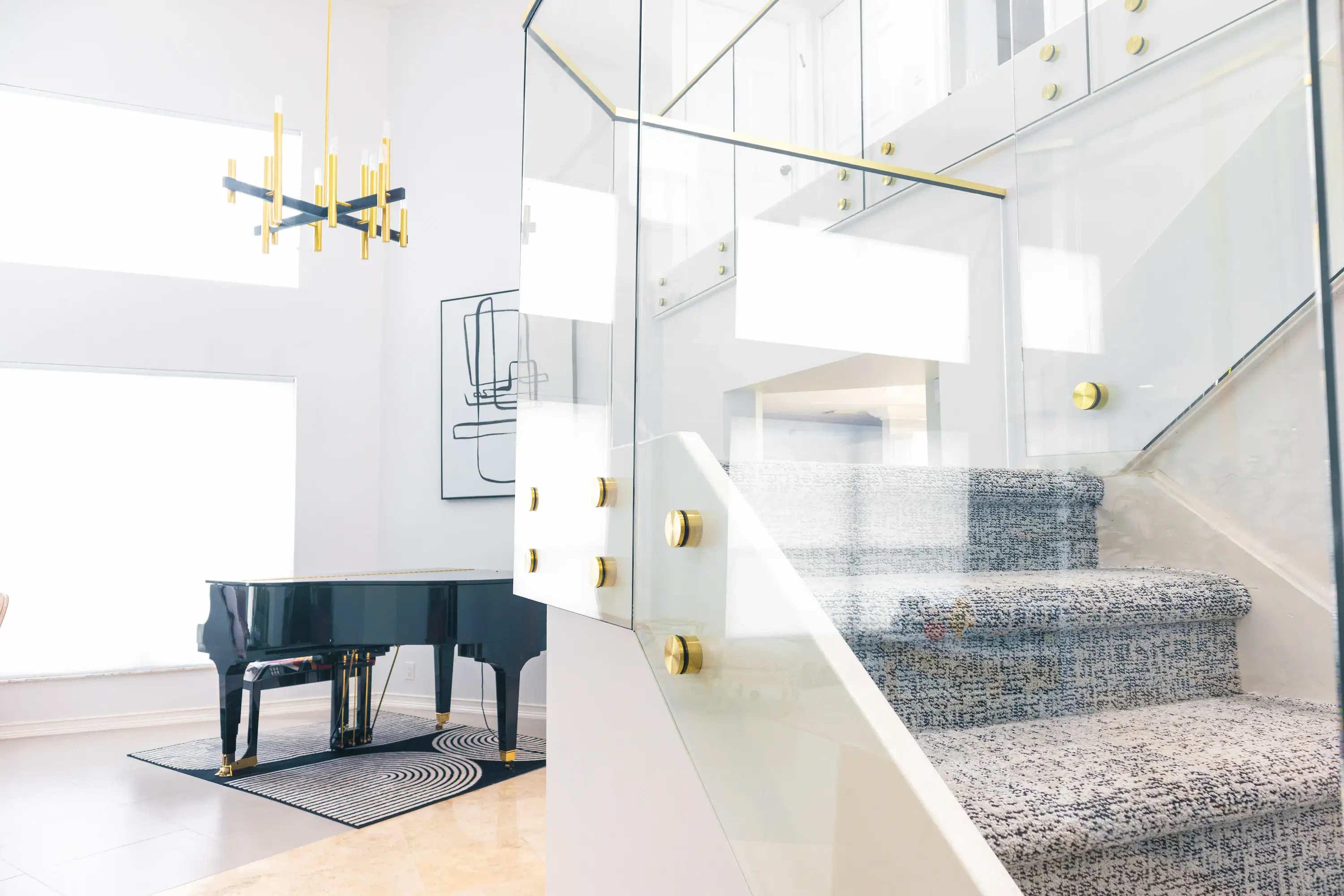 Bright interior with custom glass and mirror installations for modern home decor.