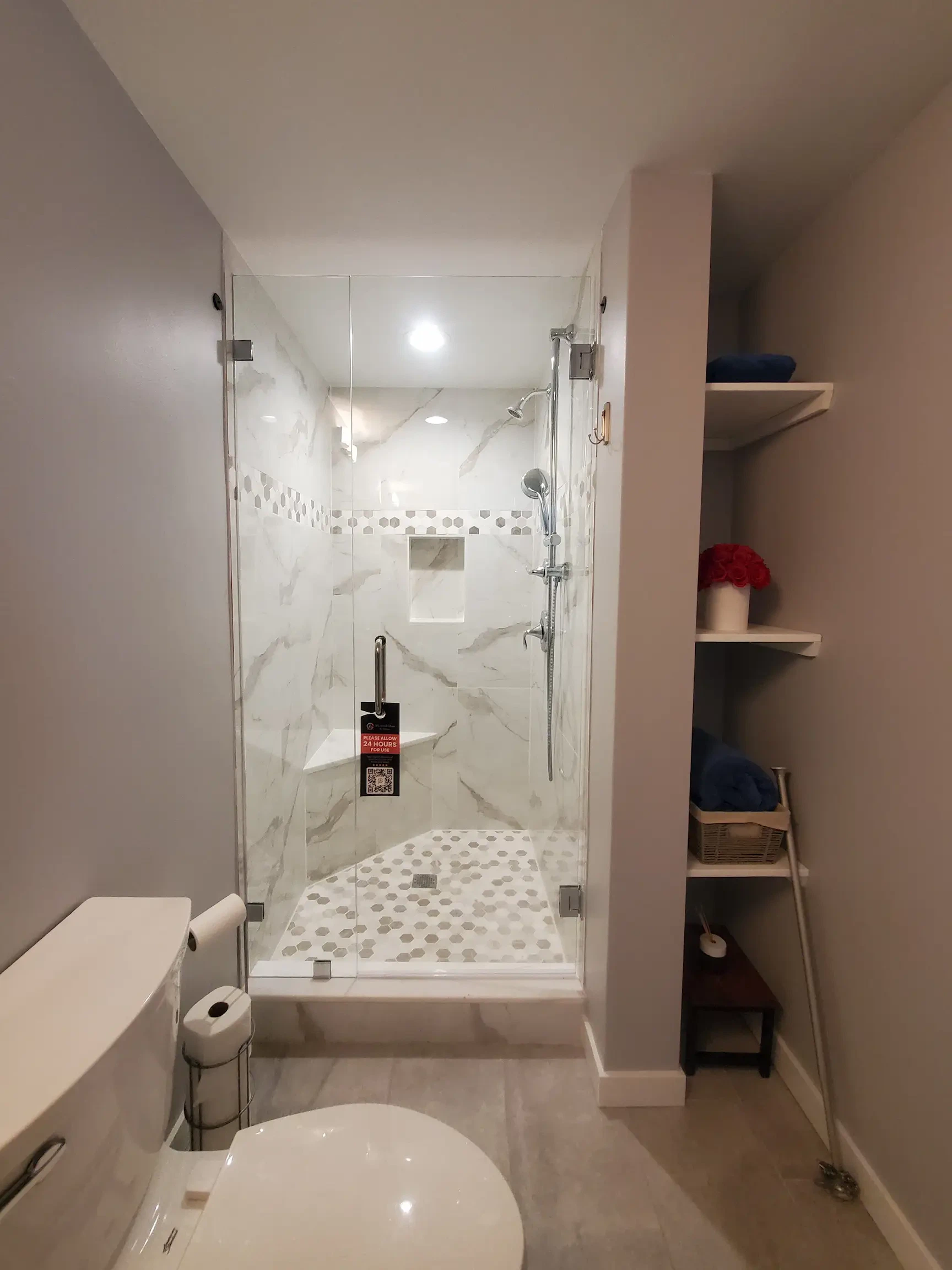 Meticulous mirror and glass shower.