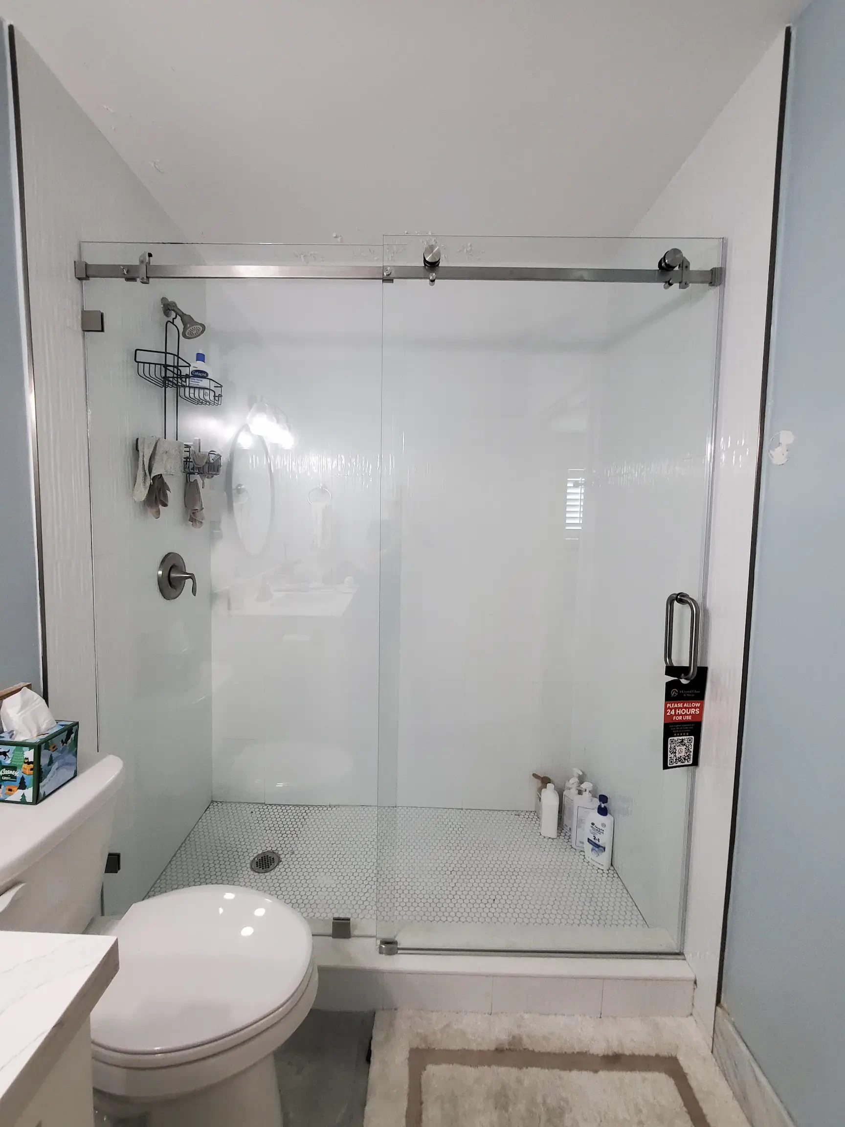 High-quality glass shower door with metal hardware for stylish bathroom upgrade.
