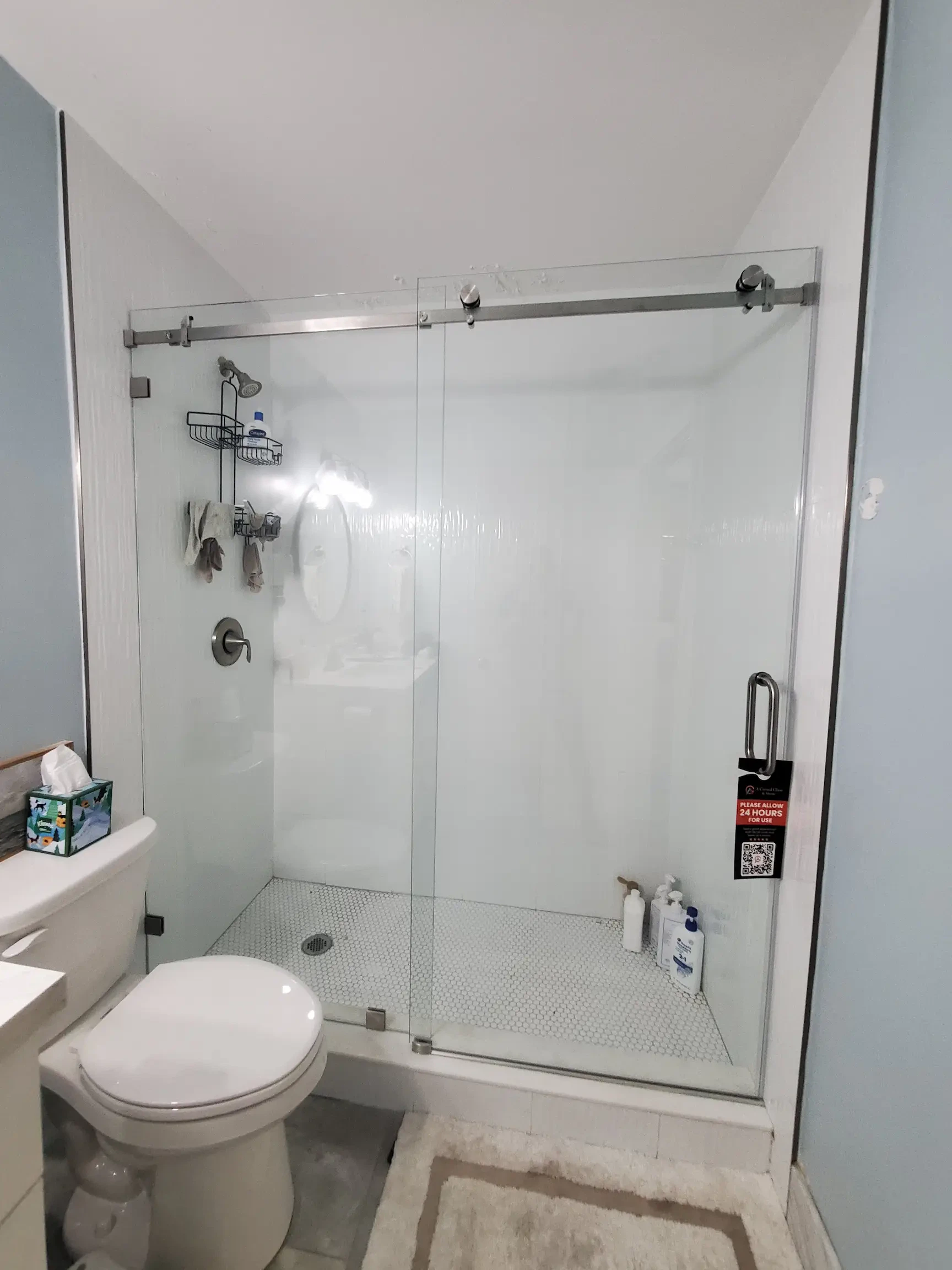 Clear frameless shower glass and mirror for modern bathrooms.