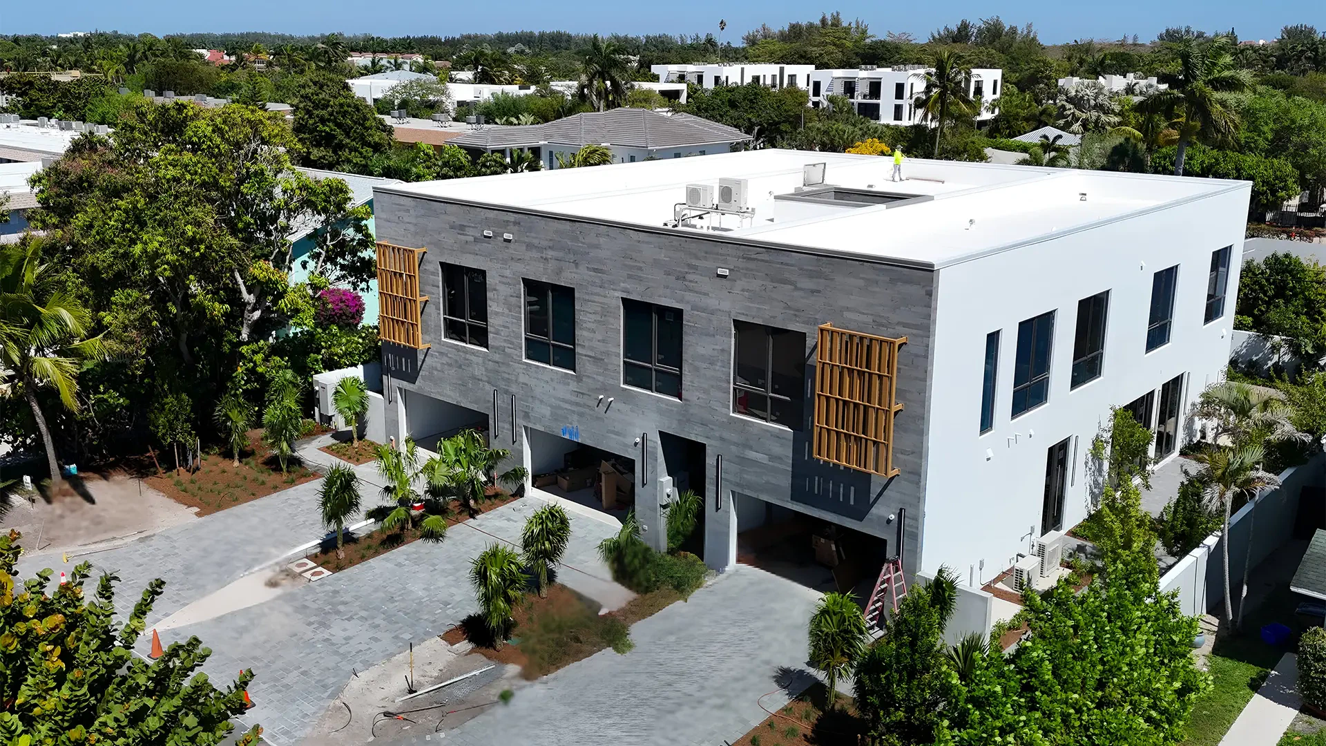 Contemporary glass and mirror building with sleek design and large windows.