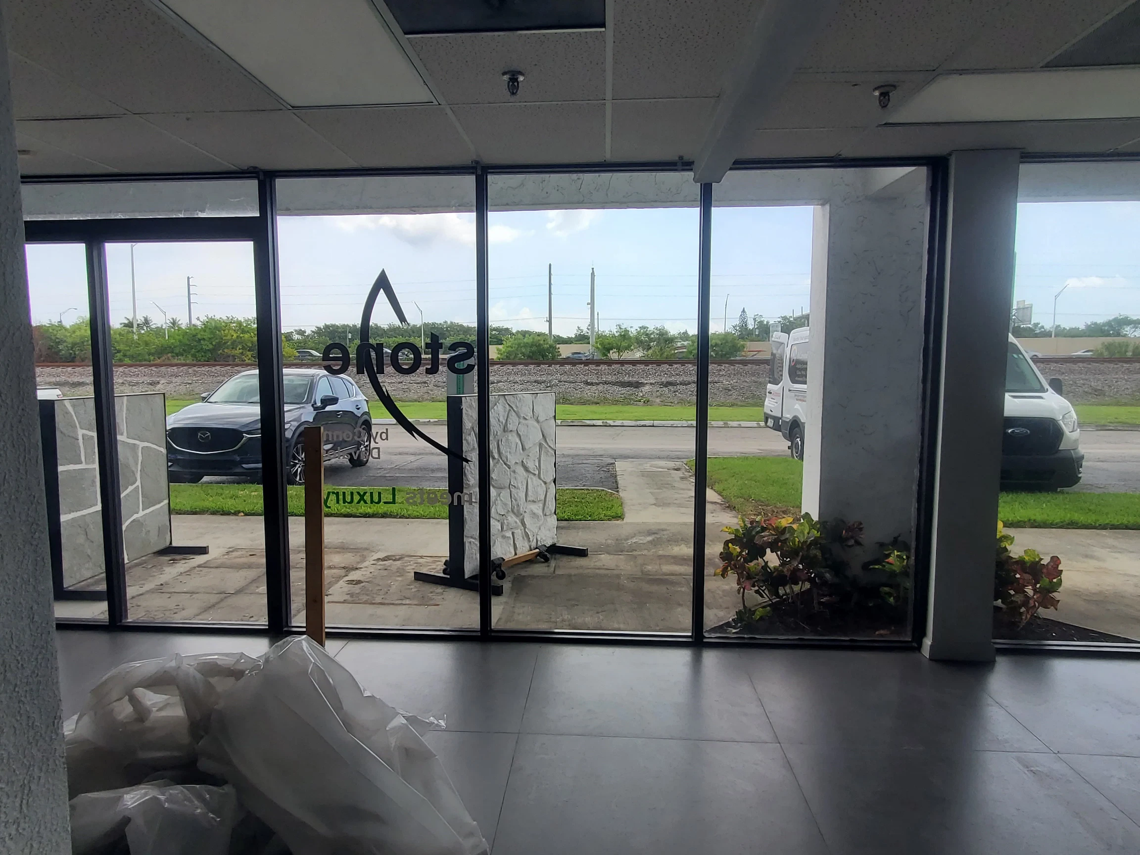 Clear glass storefront with sleek design for commercial or retail property.