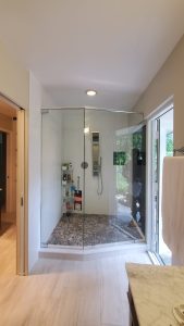 High-quality glass shower door with sleek frameless design, perfect for modern bathrooms.