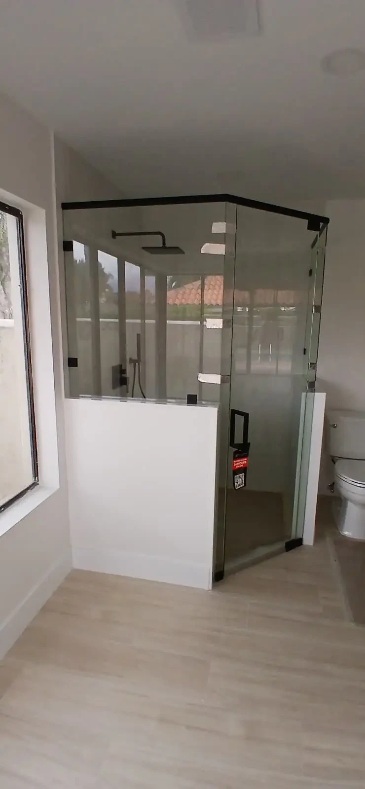 Premium glass shower enclosure with black accents and sleek modern look.