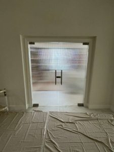 Stunning glass and mirror door enhances modern interior design and privacy solutions.