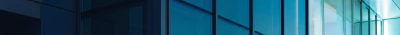 Commercial glass curtain wall at blue hour