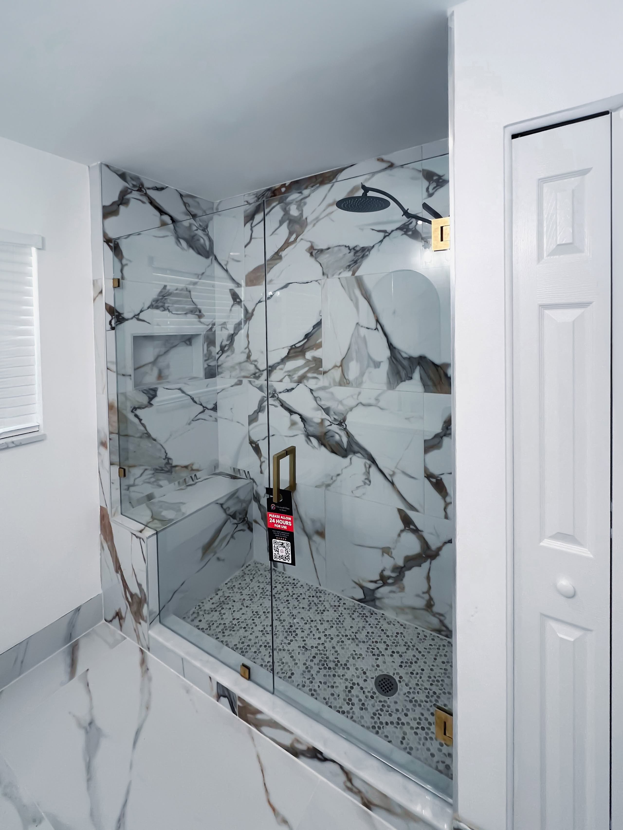 High-end marble shower glass enclosure with durable frameless design.