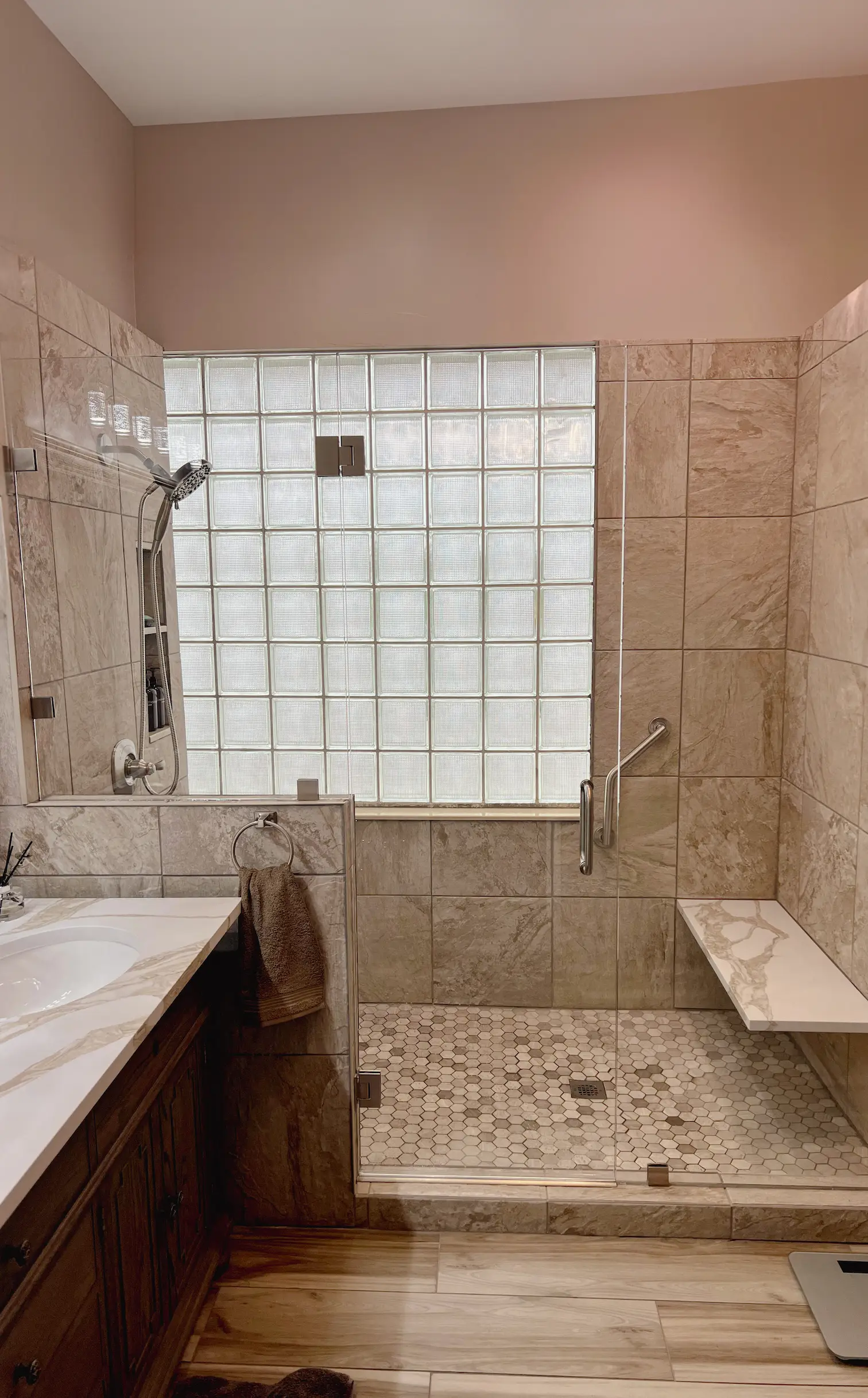 Luxury glass bathroom shower with tempered safety glass and custom mirror.
