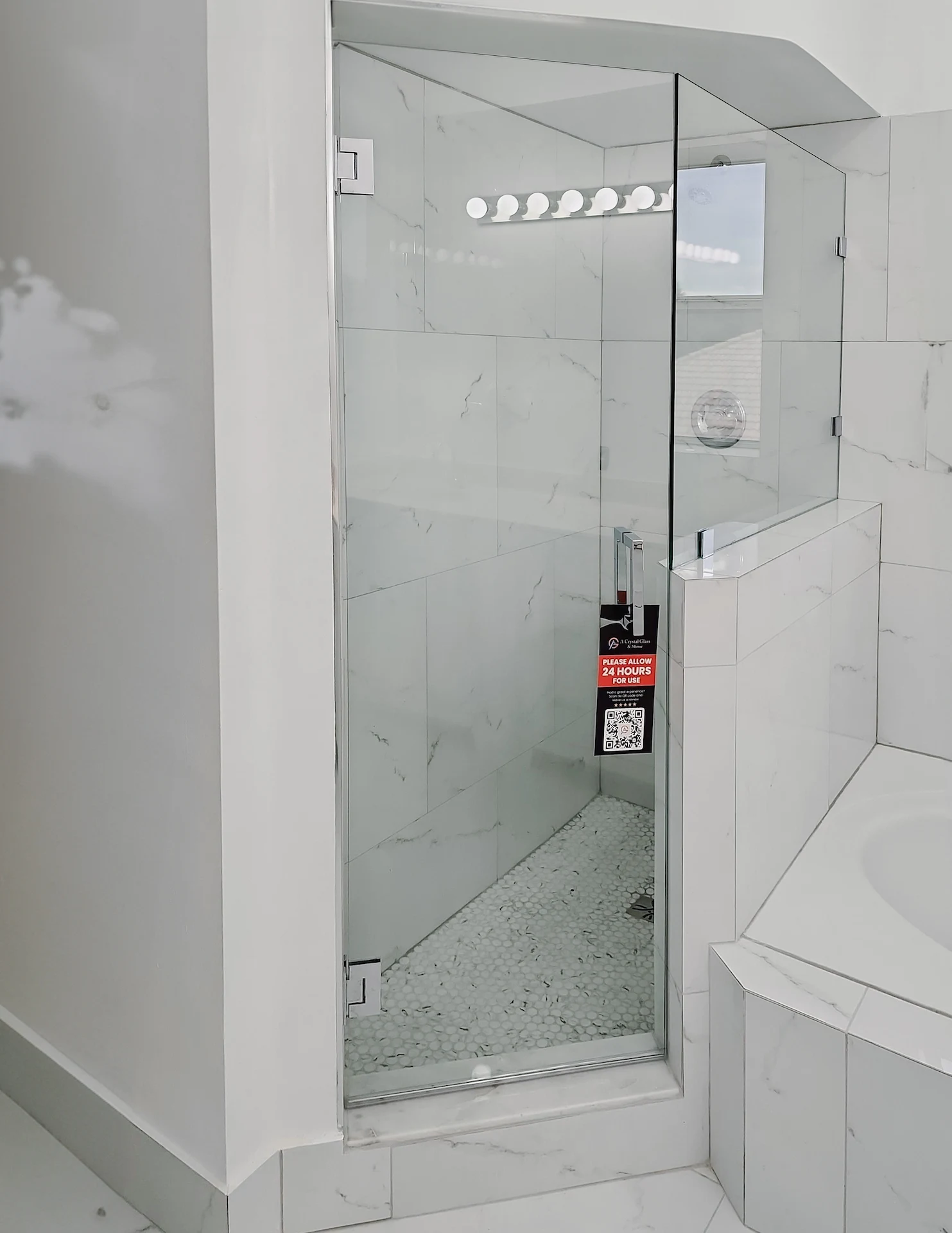 High-quality glass shower door with modern hardware, perfect for upscale bathrooms.