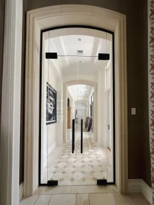 High-quality glass door with sleek black frame in elegant interior design.