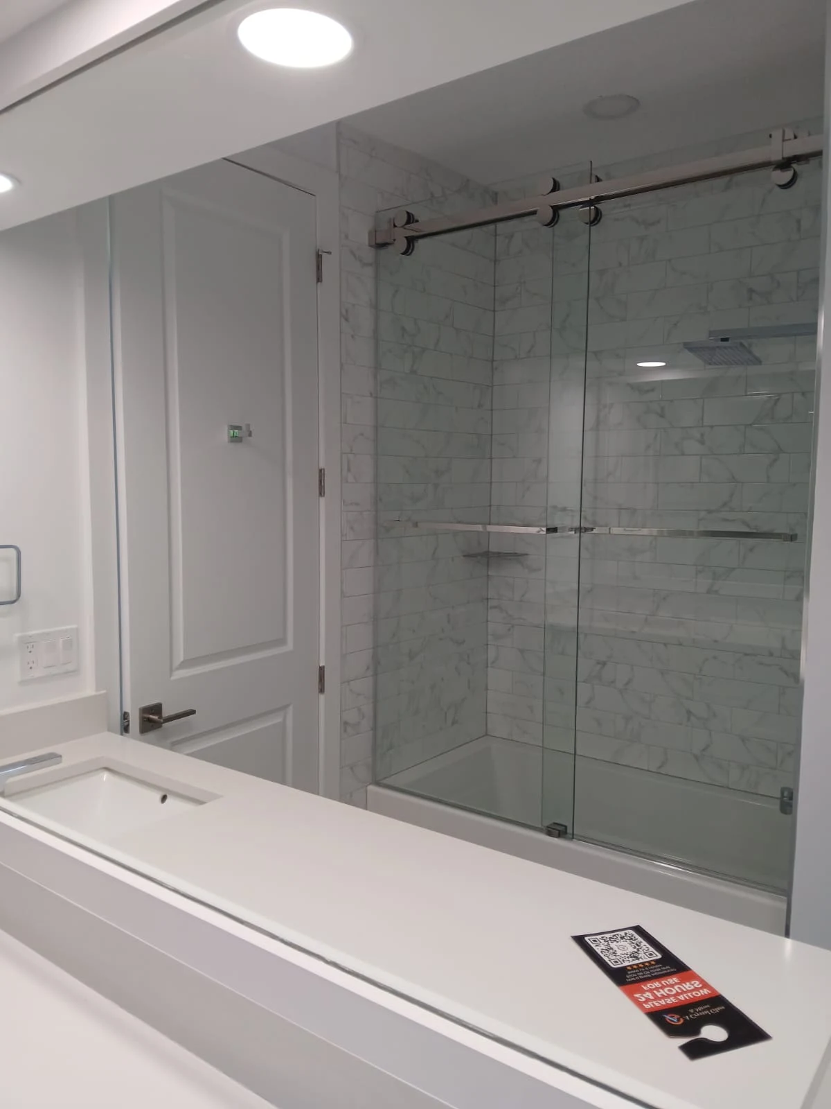 High-quality transparent glass shower enclosure in modern bathroom design.