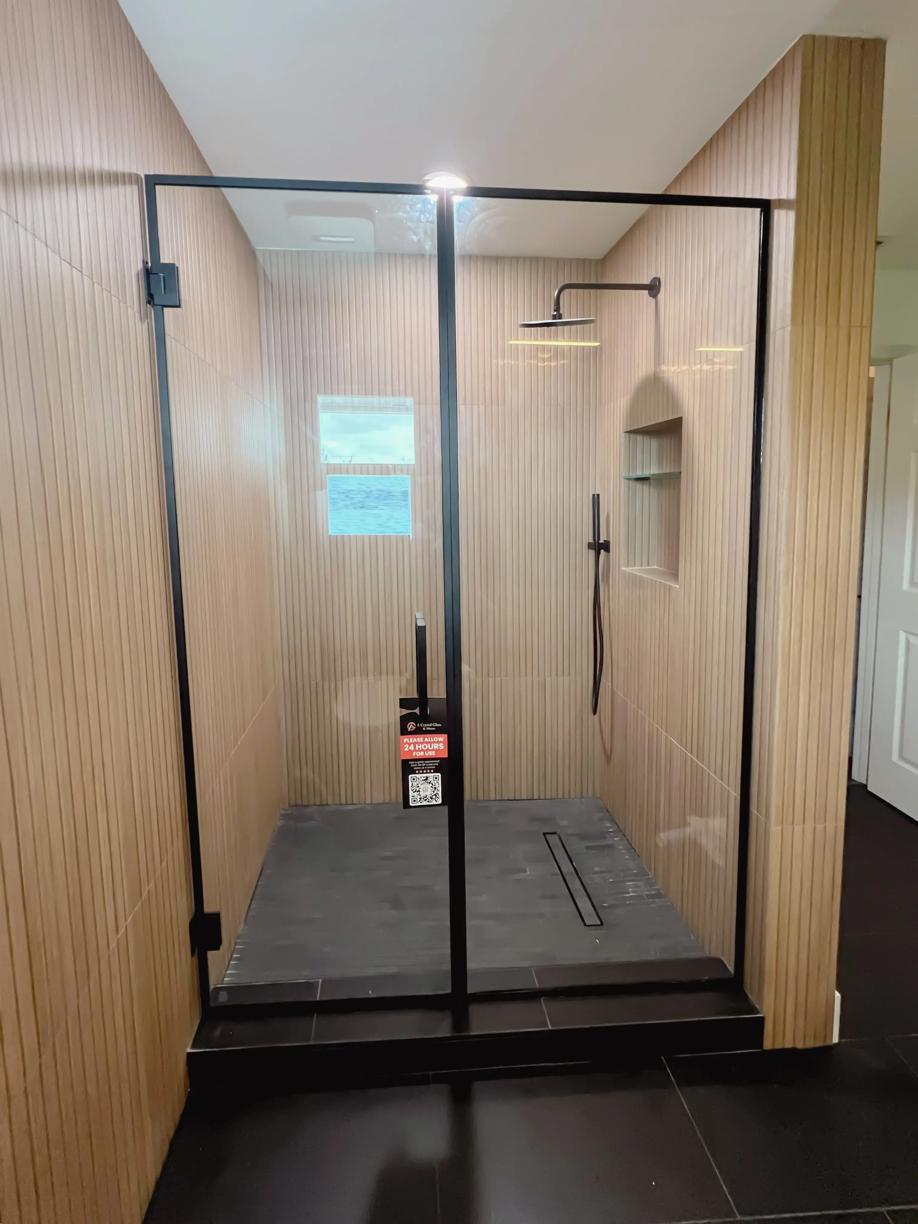 Elegant glass and mirror shower set with black accents, designed for luxurious bathrooms.