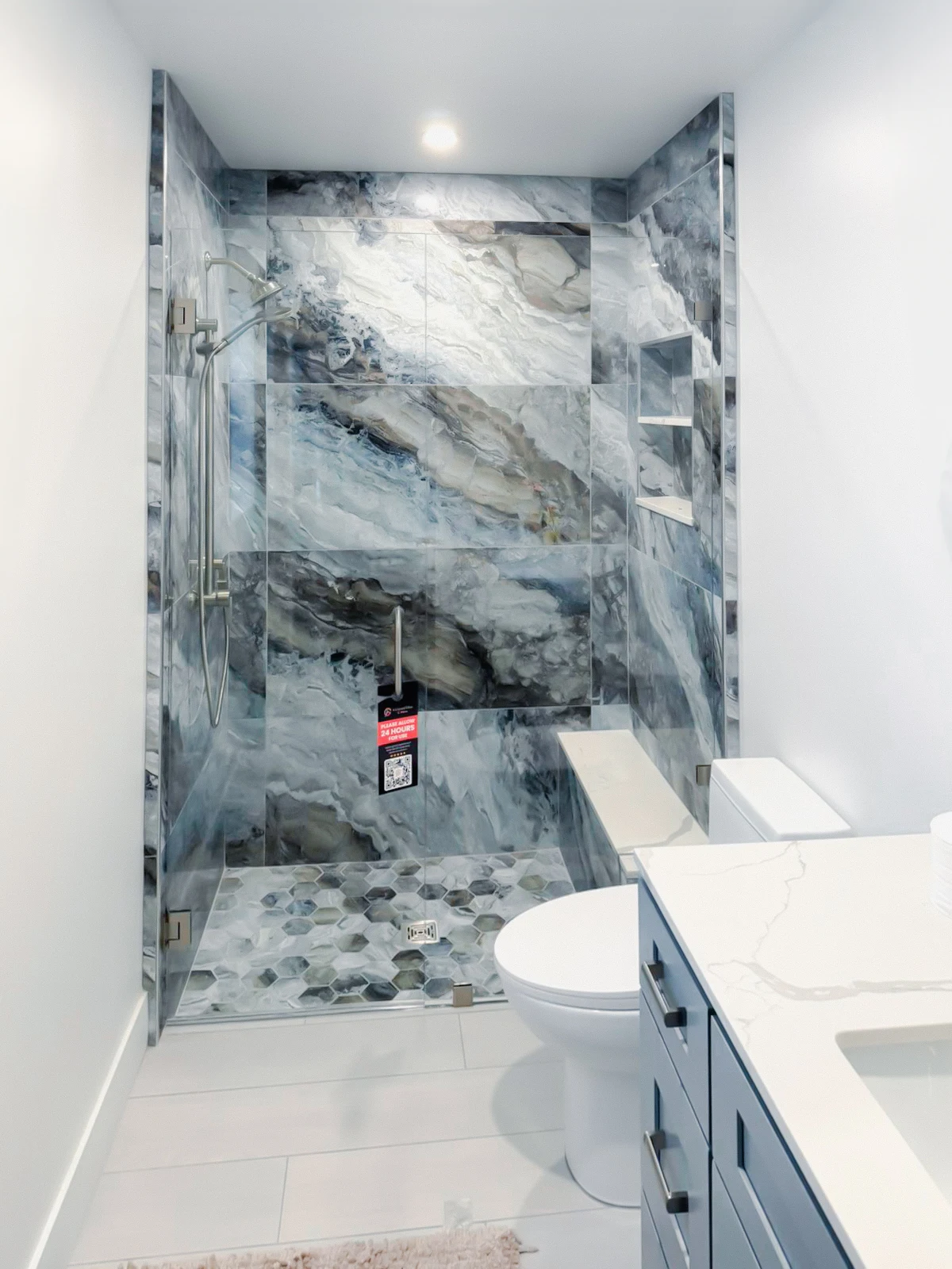 Enhanced marble shower glass wall for modern bathroom design.
