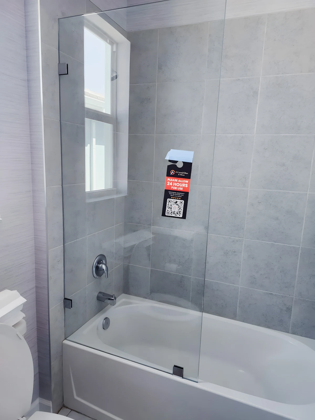 High-quality glass shower door with seamless installation in modern bathroom.