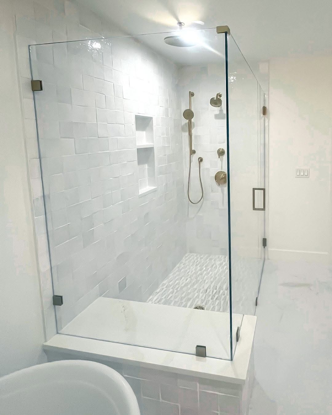 High-quality glass shower door with modern fixtures, waterproof tile walls, and elegant design.