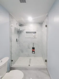 Elegant glass shower door with sleek hardware, perfect for contemporary bathrooms.