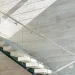 Stunning glass and mirror staircase showcasing crystal glass design in a contemporary interior.