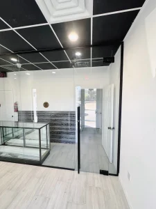 High-quality glass partition with sleek black framing in modern commercial space.