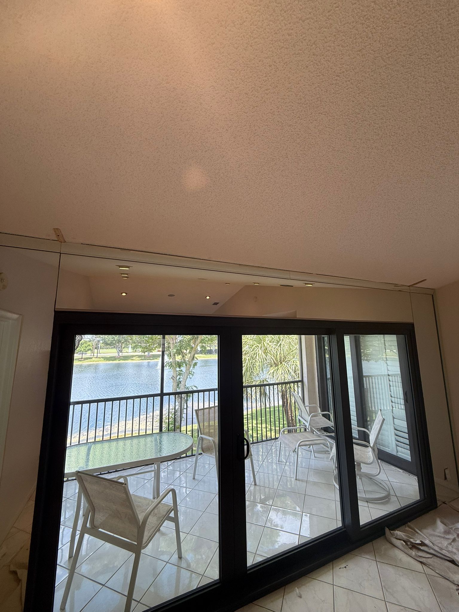 High-quality sliding glass door with reflective surface, elegant and durable.