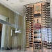 Bright, sleek wine storage with glass walls, showcasing premium bottles and stylish design.