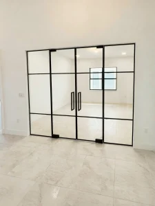 Elegant black-framed glass closet door for stylish interiors.