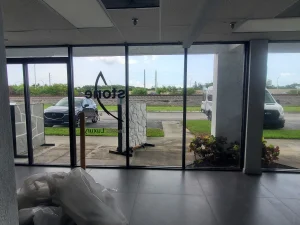 Clear glass storefront with sleek design for commercial or retail property.