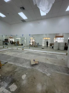 Clear glass mirror for modern interior decor and space enhancement.