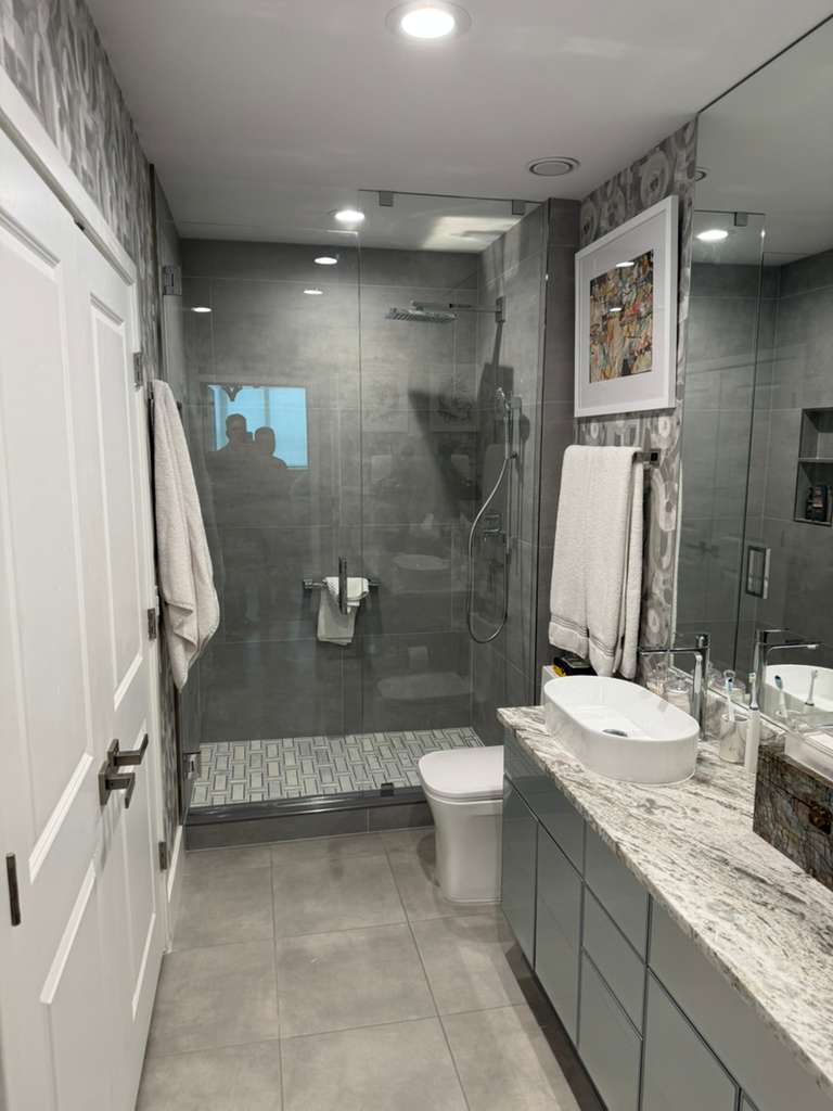 Elegant glass shower enclosure with modern design.