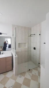 High-quality glass shower door with sleek black fixtures, minimalist style bathroom upgrade.