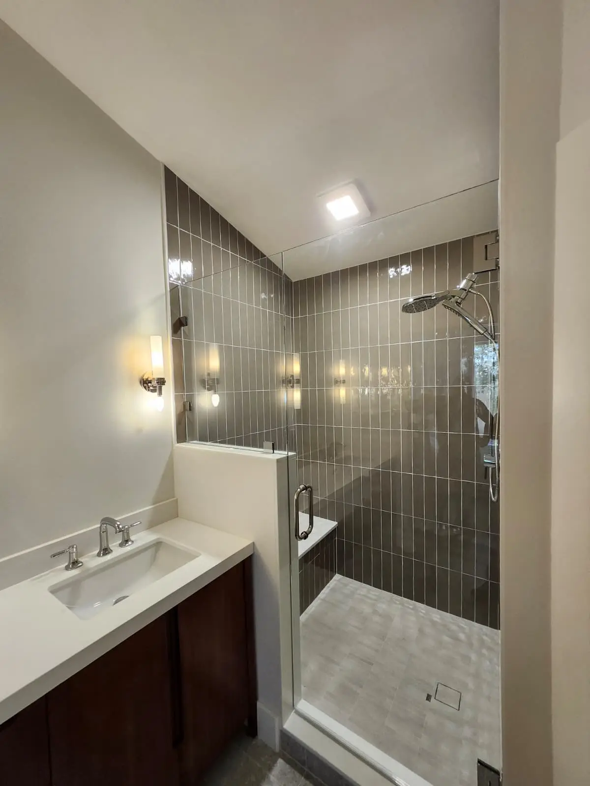 High-quality glass shower enclosure with chrome fixtures and modern design. Perfect for stylish bathroom renovations.