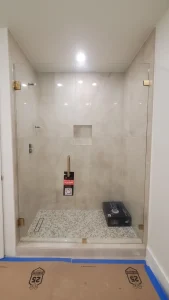 High-quality glass shower enclosure with durable hardware and seamless design.