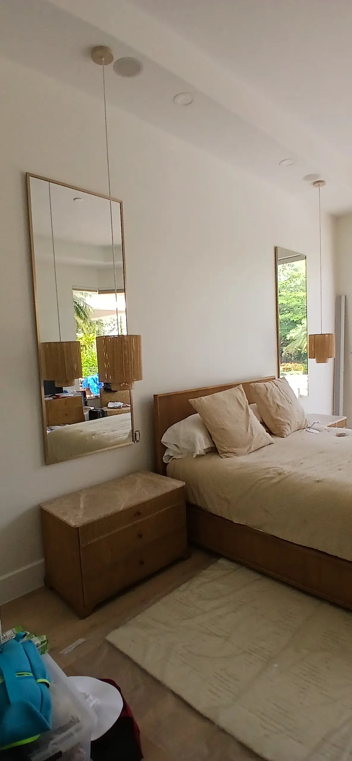 Reflective crystal glass mirror enhances bedroom decor and ambiance.